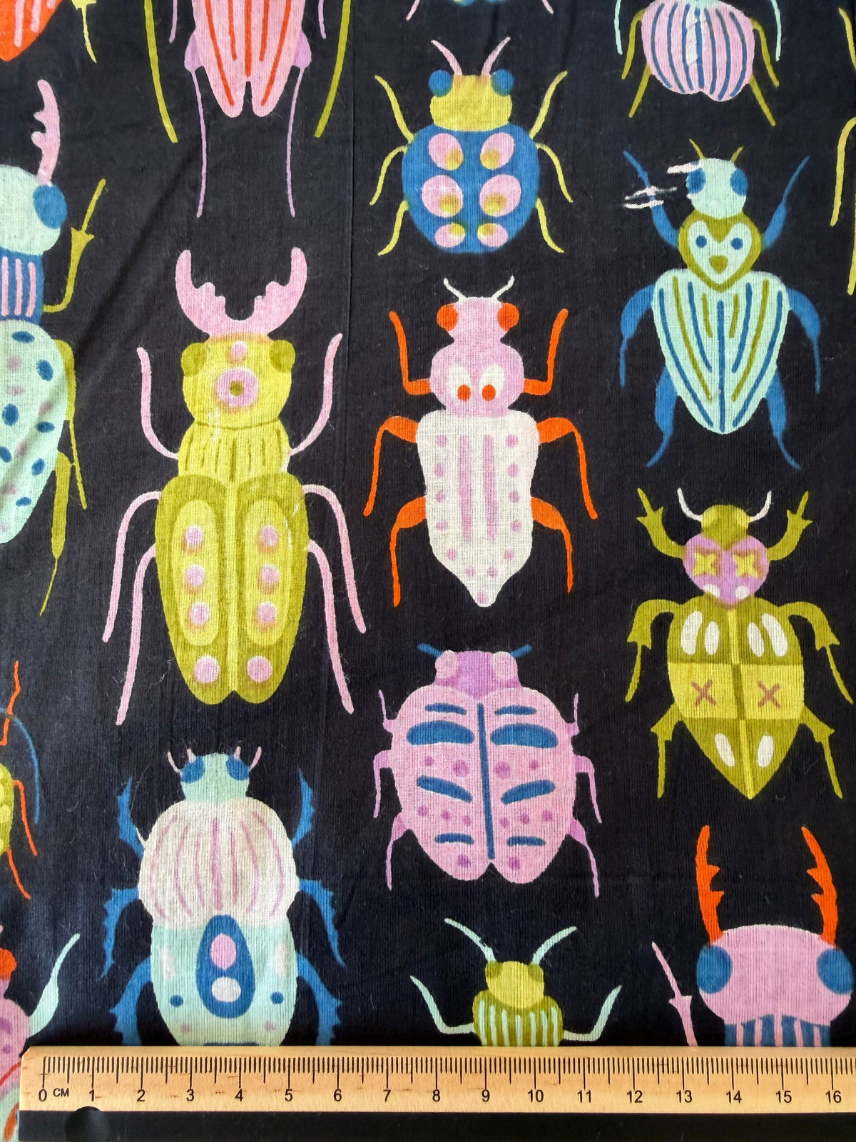100% Cotton Fabric – Black With Colourful Bugs