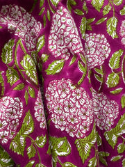 Close-up of fabric with floral pattern on a purple background