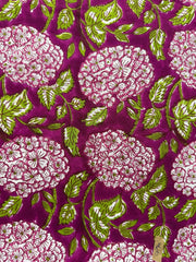 Close-up of fabric with floral pattern on a purple background