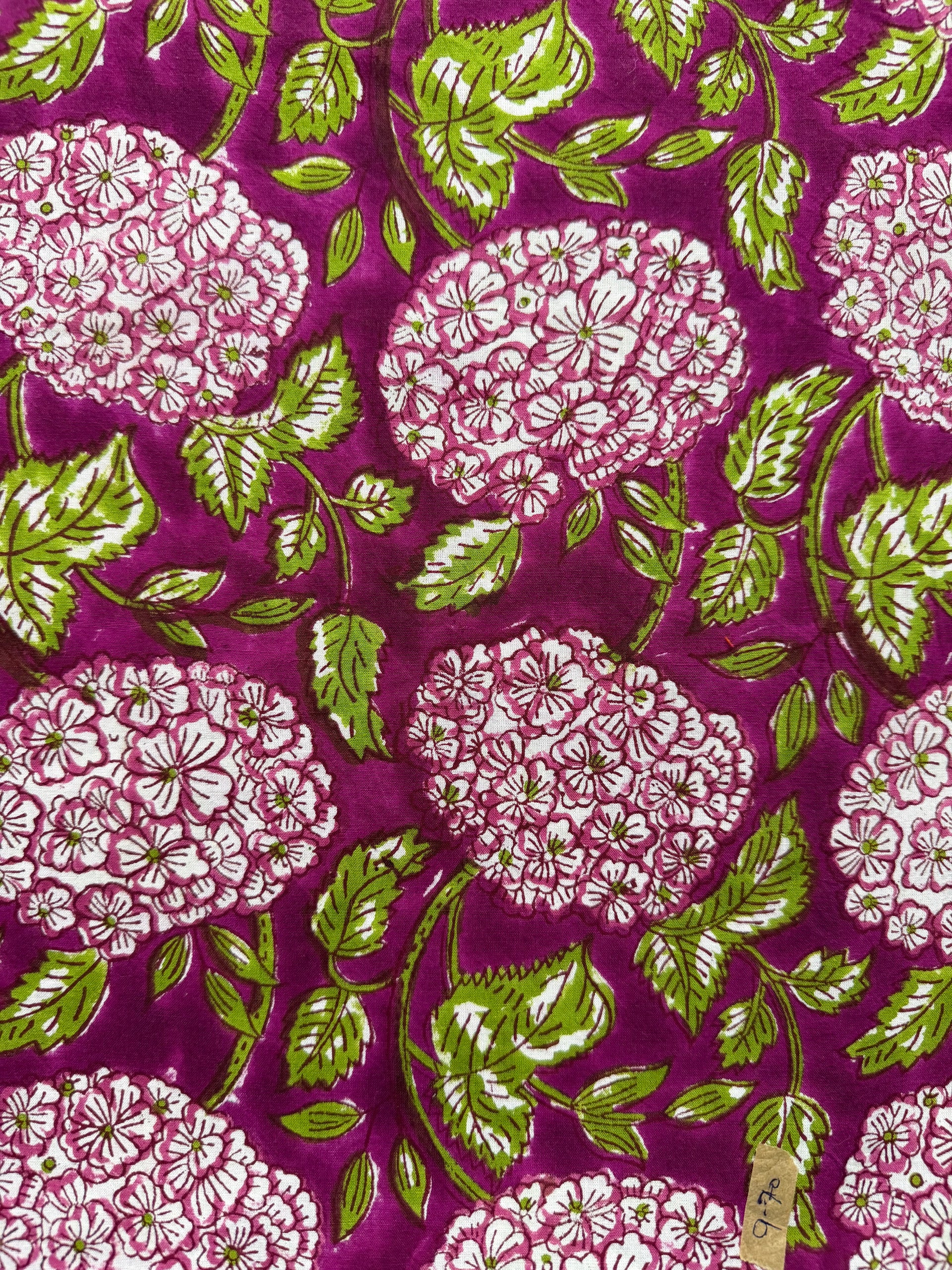 Close-up of fabric with floral pattern on a purple background