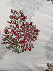 Embroidered floral design on a white fabric background