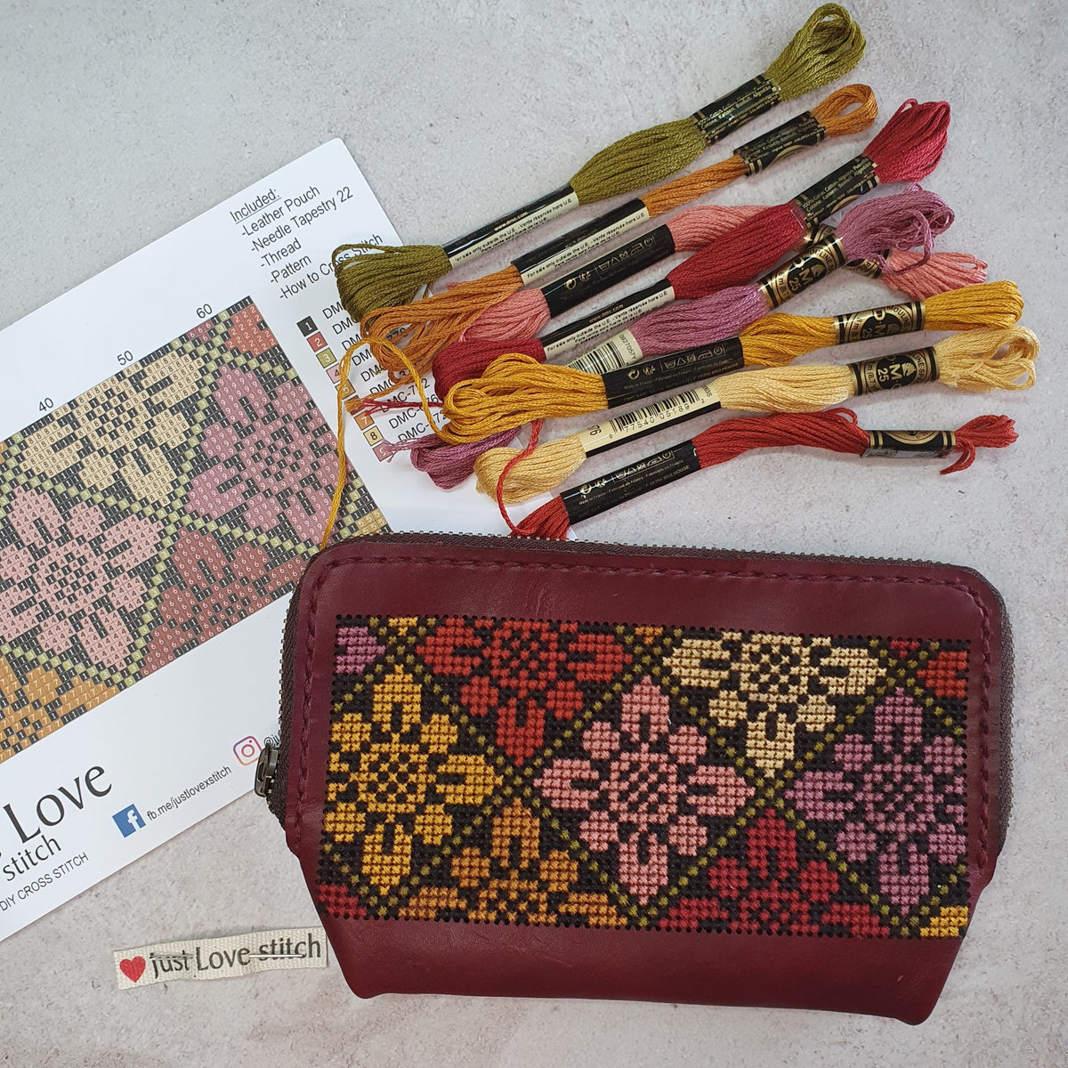 Cross-stitch leather zipper pouch kit with embroidery threads, pattern and floral pouch